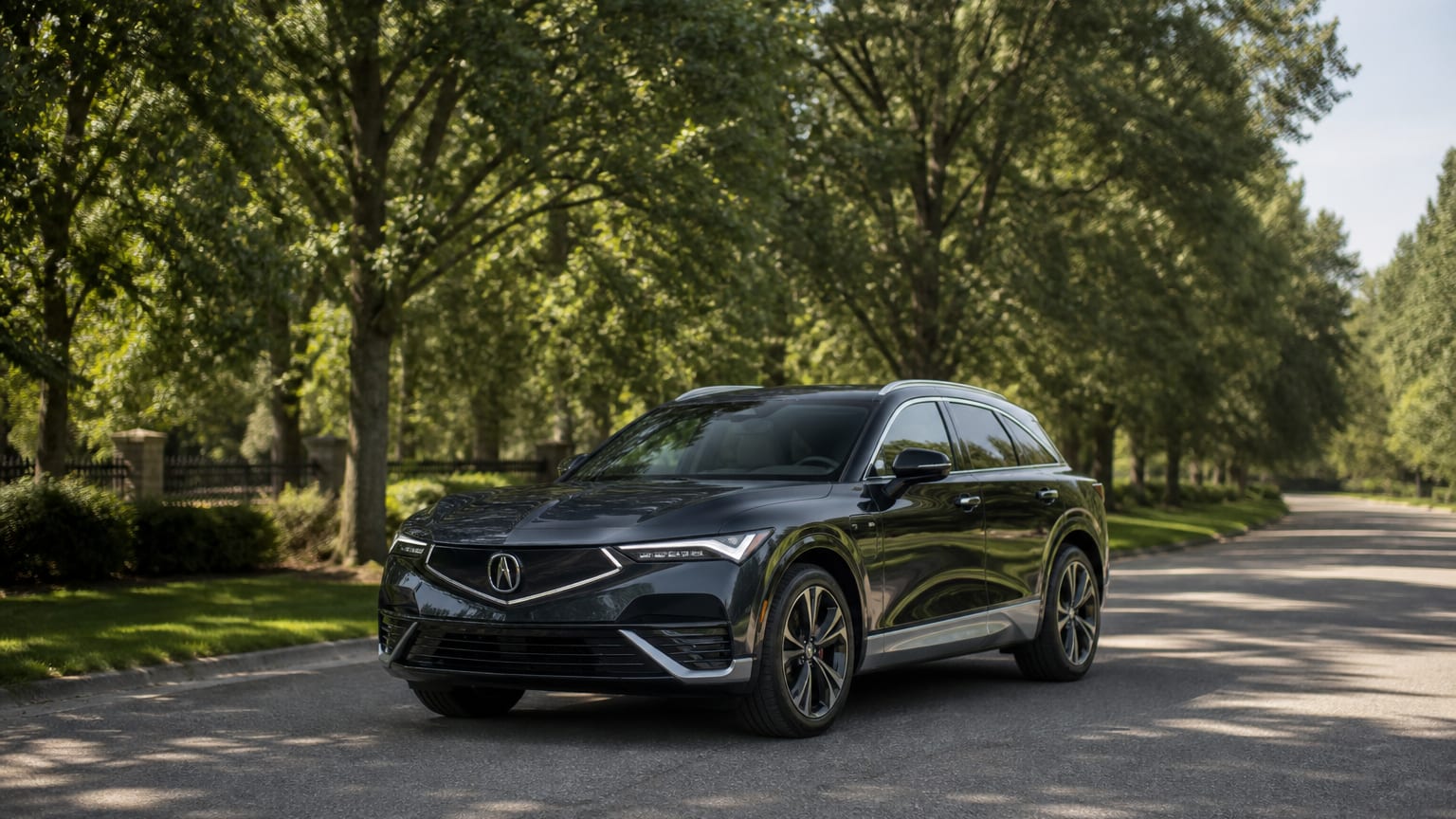 A cleaner later-model Acura ZDX on a quiet road.
