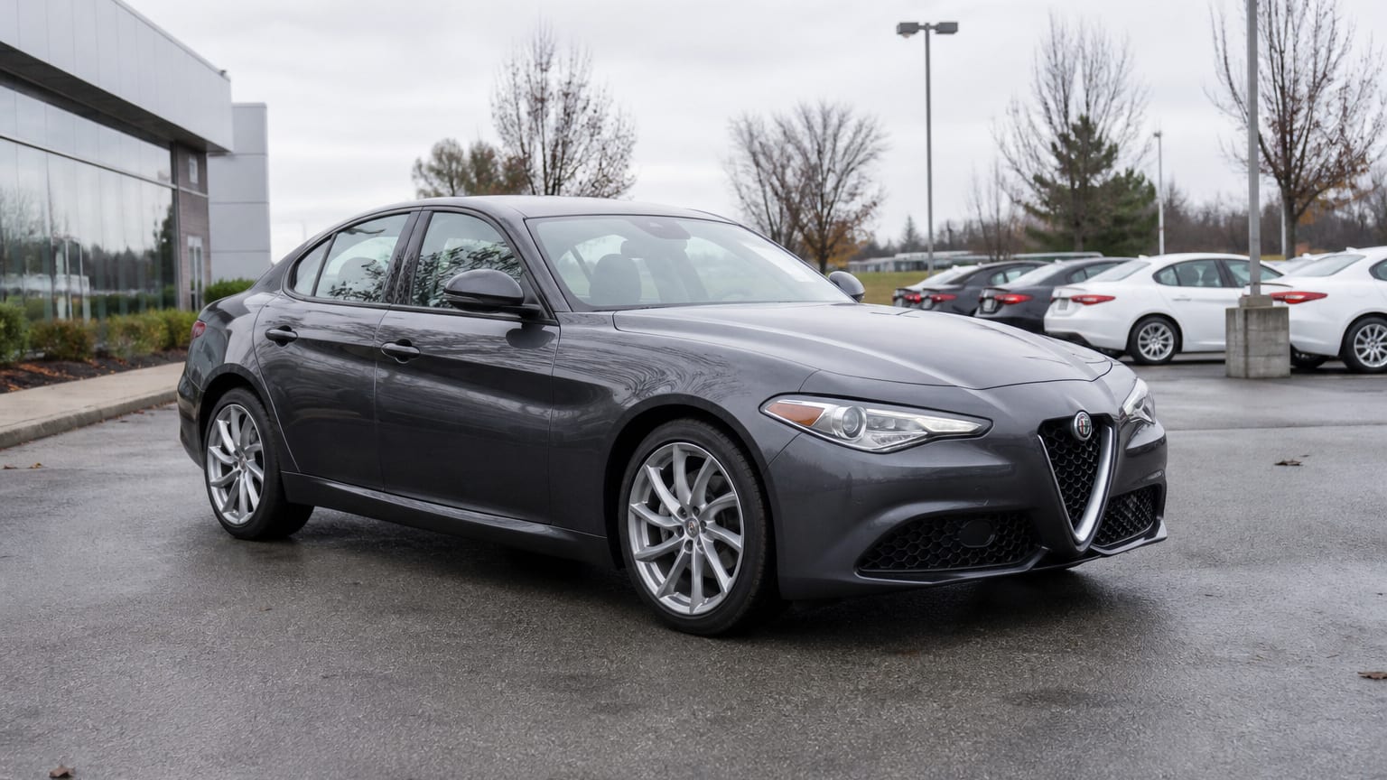 A higher-risk Alfa Romeo Giulia model year parked in a dealership lot.