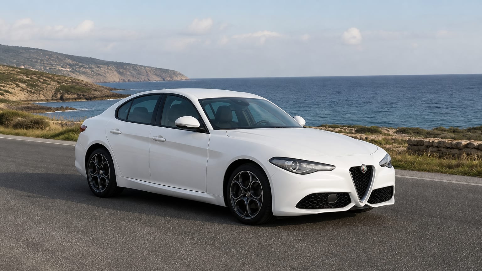 A Alfa Romeo Giulia parked outdoors, three-quarter front view.