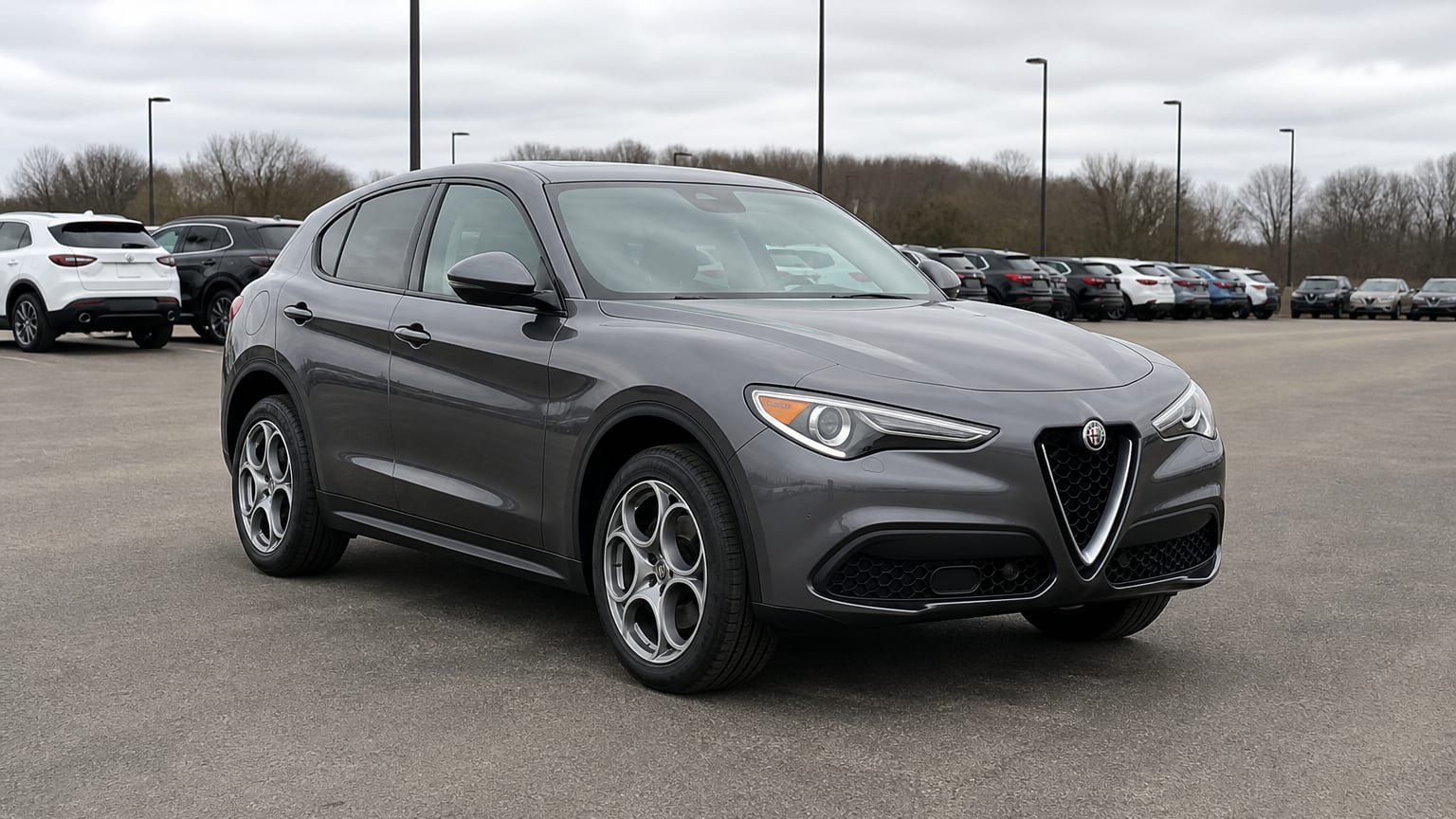 A higher-risk Alfa Romeo Stelvio model year parked in a dealership lot.