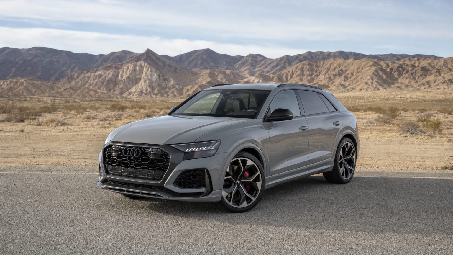 A Nardo Gray Audi RS Q8 parked on a desert highway pullout.