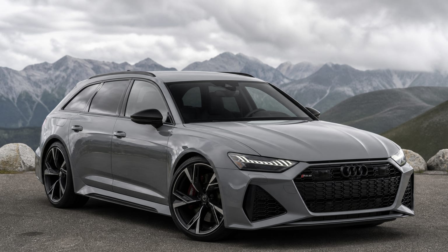 A Nardo Gray Audi RS6 Avant wagon parked on a mountain overlook.