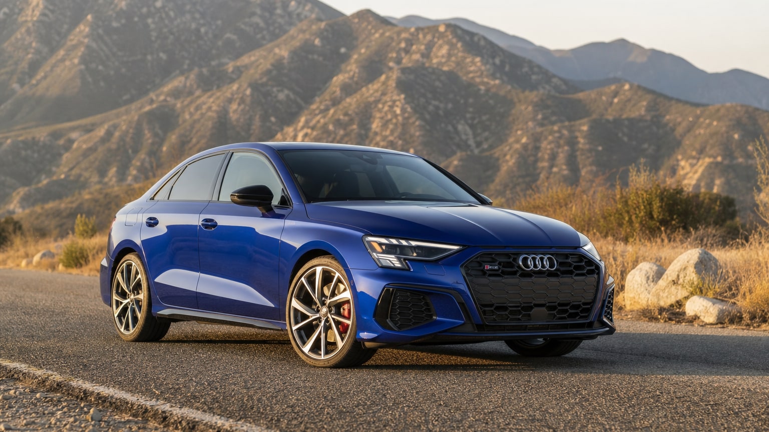 A late-model 2018–2022 Audi S3 on a mountain road.