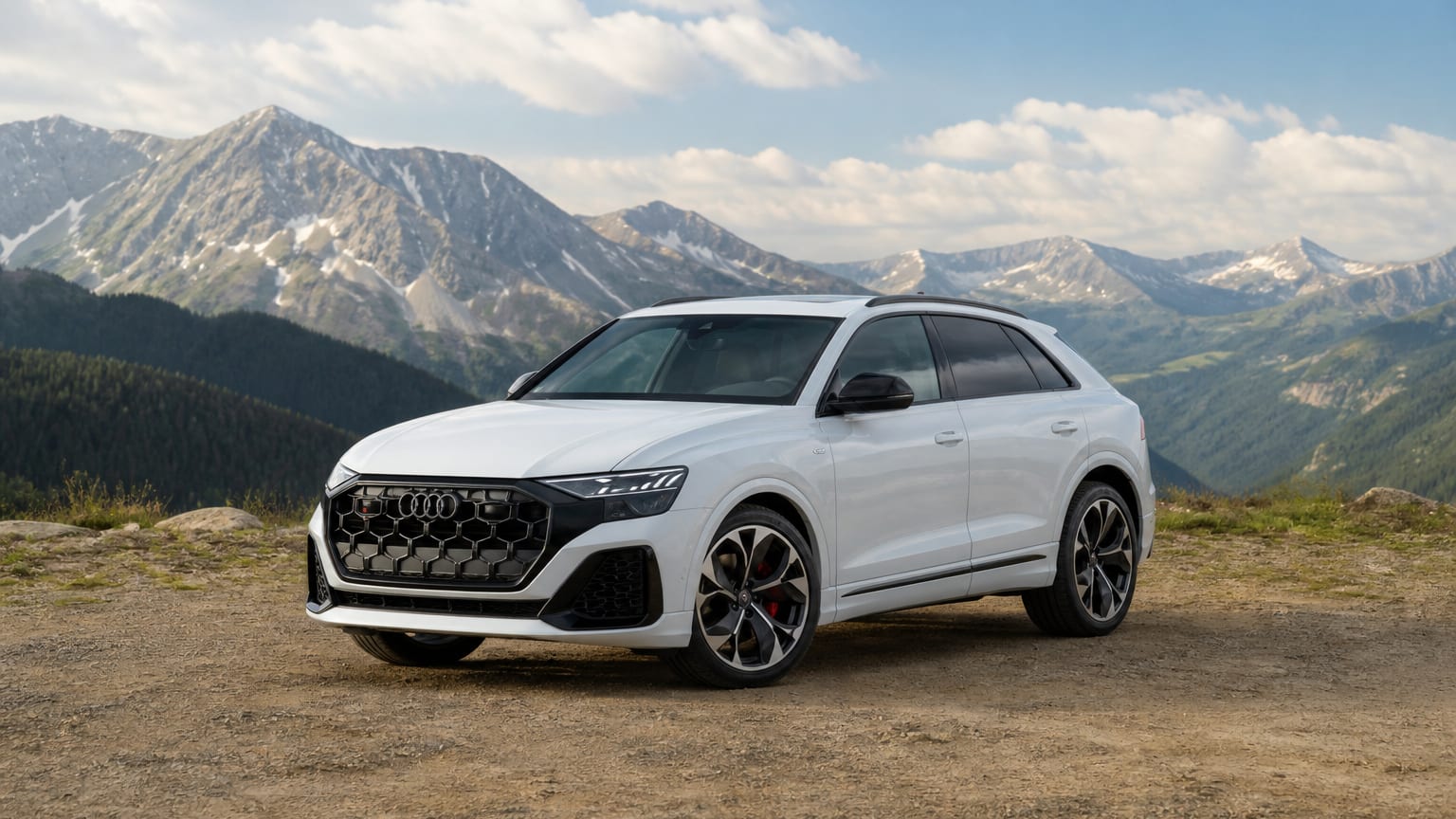 A late-model 2023–2025 Audi SQ8 on a mountain overlook.