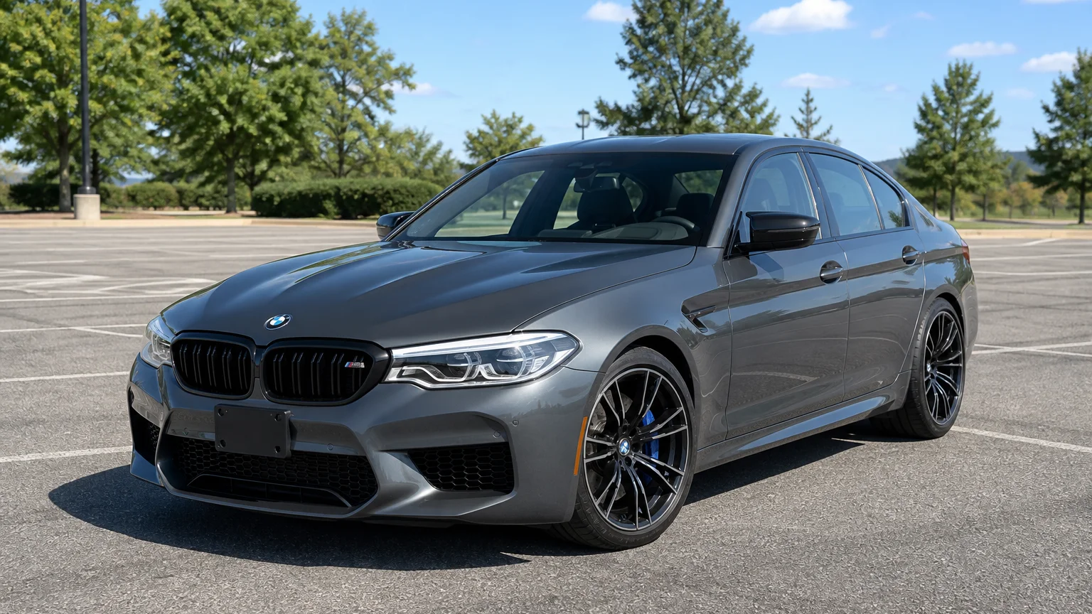 A BMW M5, three-quarter front view, parked outdoors.