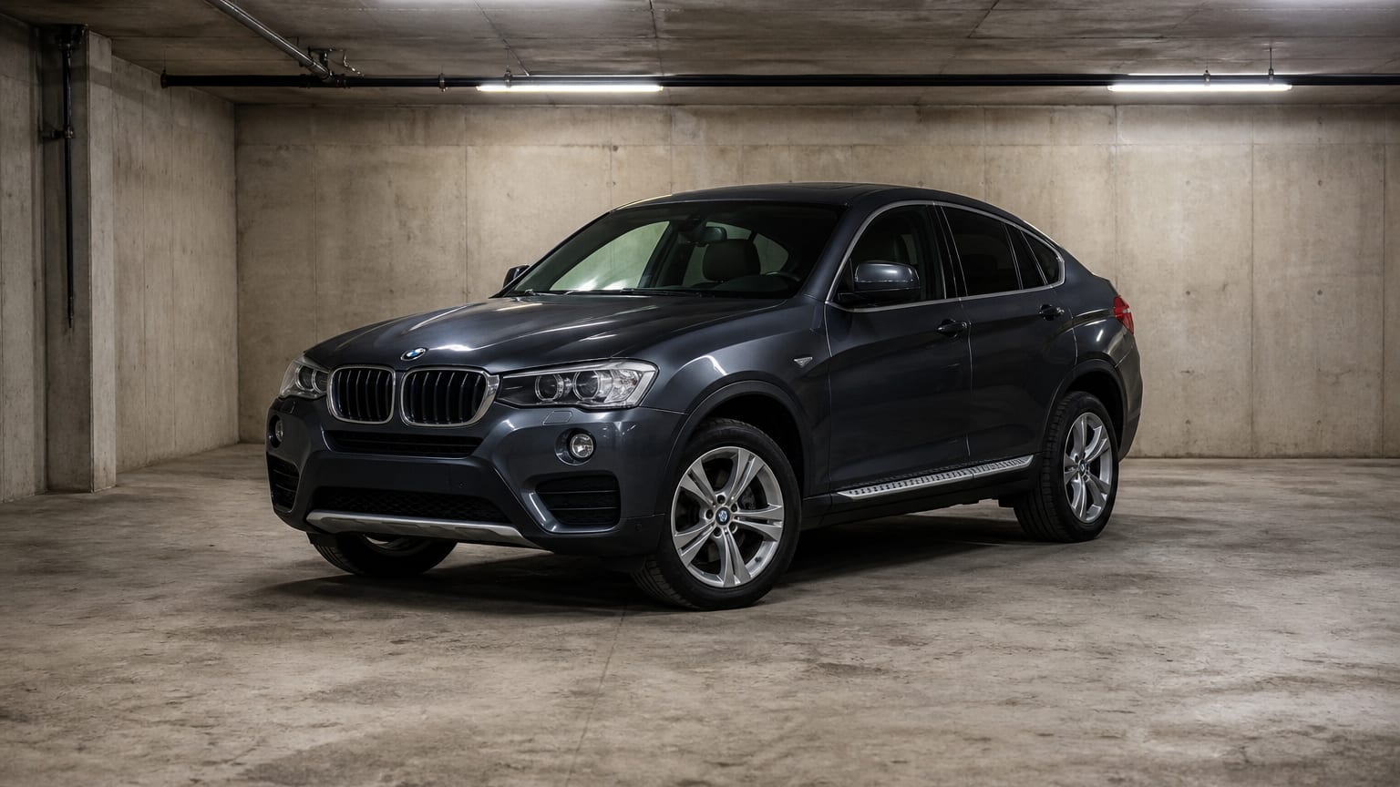 A higher-risk BMW X4 model year parked in a dealership lot.