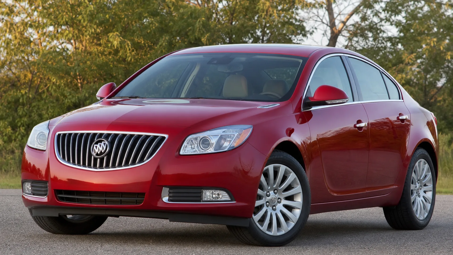 A red Buick Regal sedan parked outdoors.