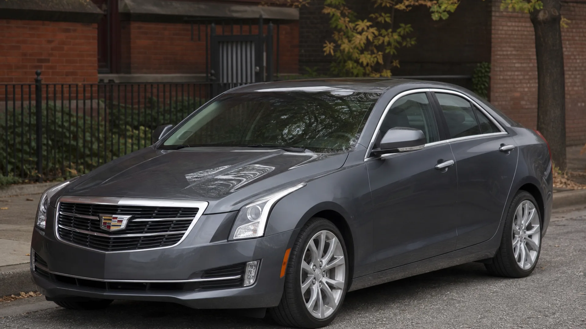 A grey Cadillac ATS sedan parked on a street.