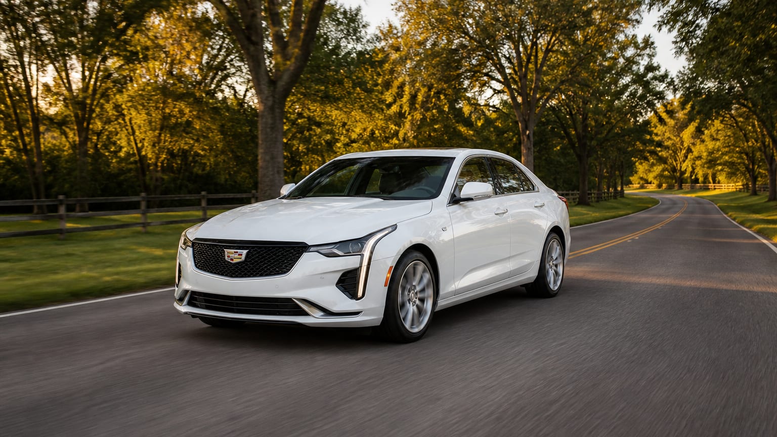 A cleaner later-model Cadillac CT4 on a quiet road.