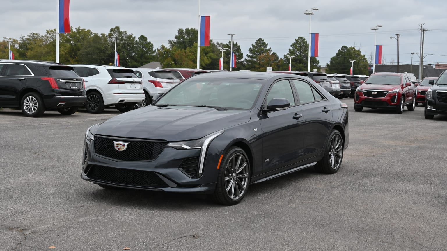 A higher-risk Cadillac CT4 model year parked in a dealership lot.