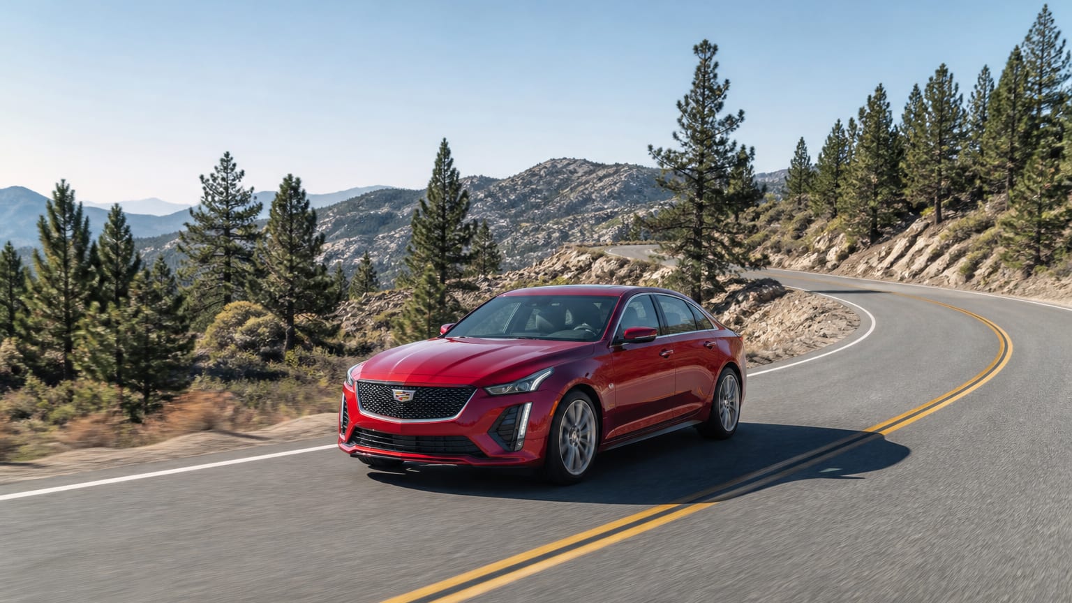 A cleaner later-model Cadillac CT5 on a quiet road.