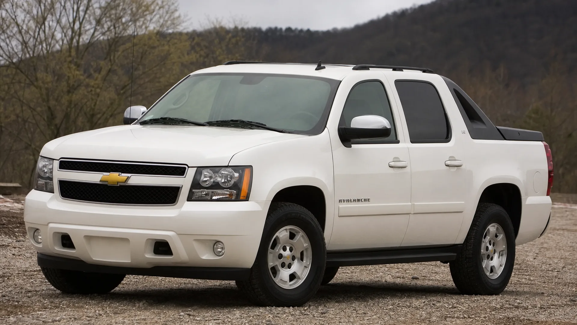 A white Chevrolet Avalanche pickup parked outdoors.
