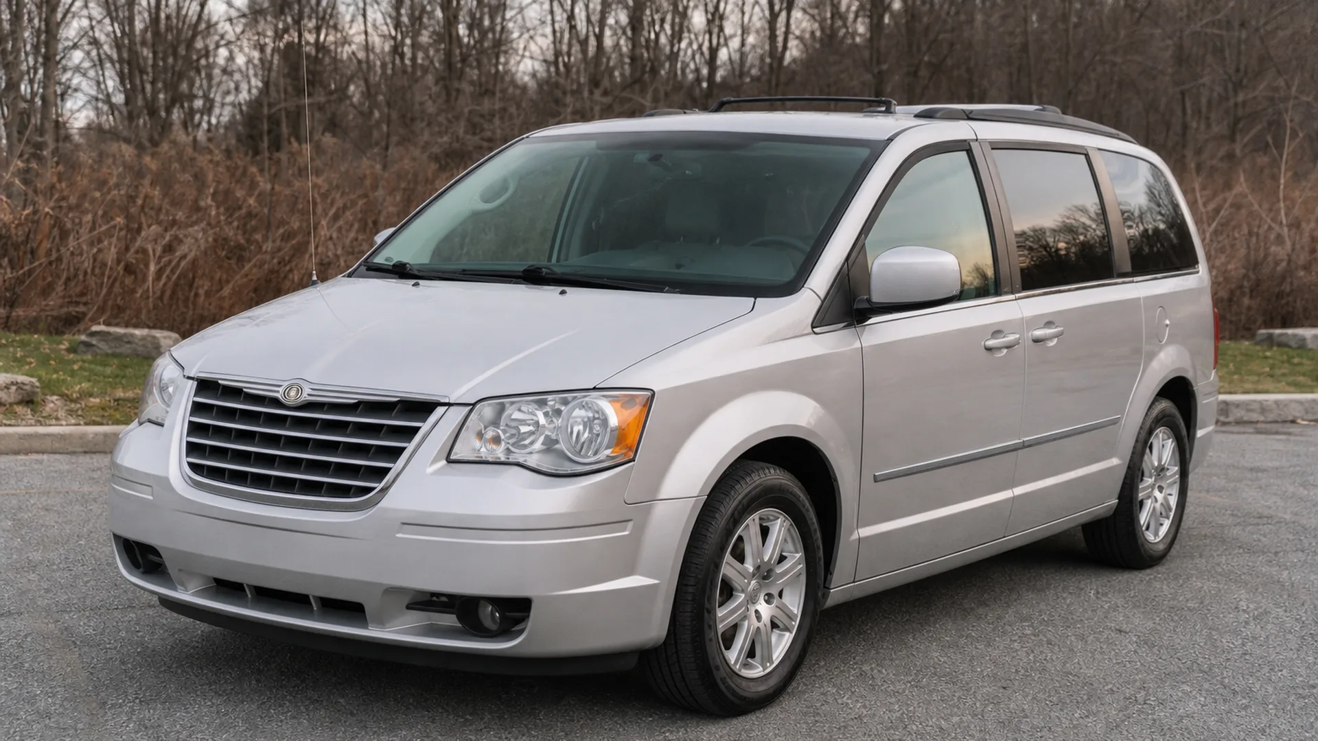 A Chrysler Town Country parked outdoors.