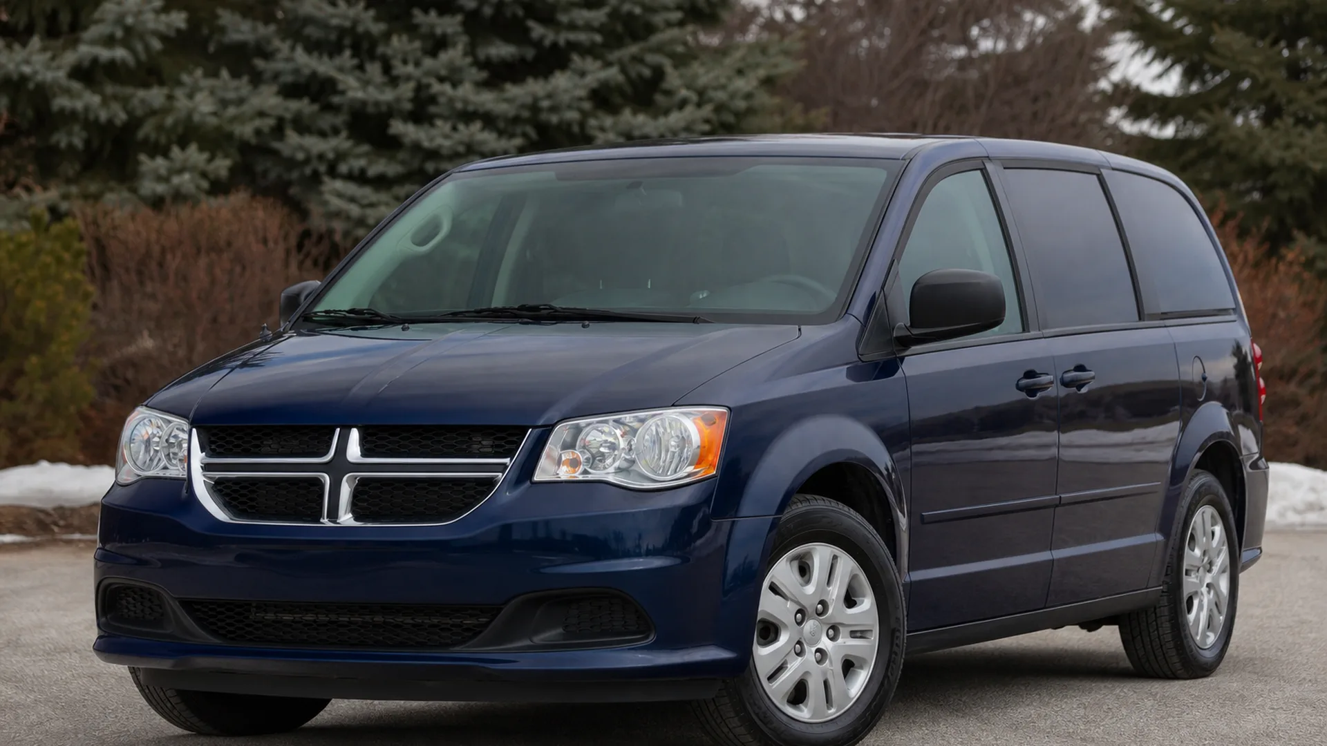 A Dodge Caravan parked outdoors.