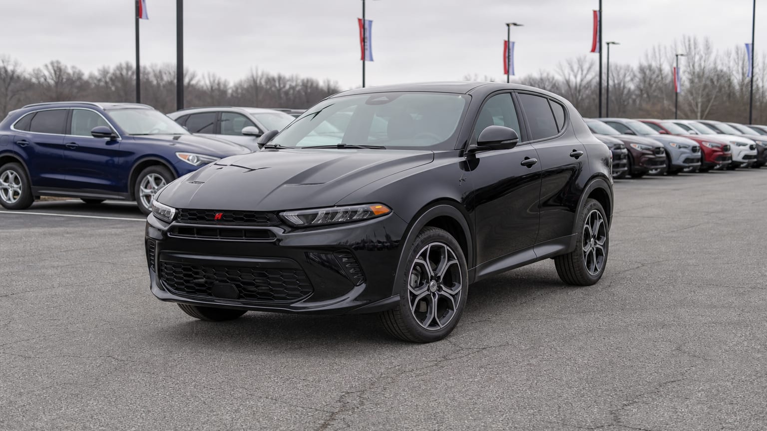 A higher-risk Dodge Hornet model year parked in a dealership lot.
