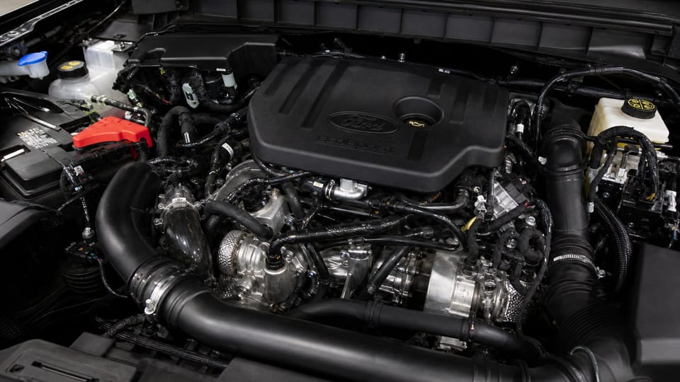 Close-up of a Ford Bronco EcoBoost engine bay under the open hood.