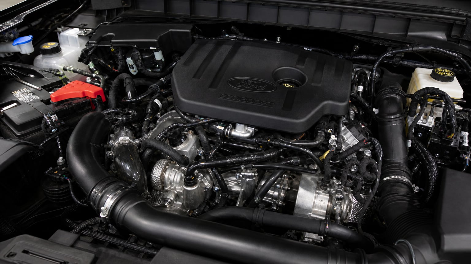 Close-up of a Ford Bronco EcoBoost engine bay under the open hood.