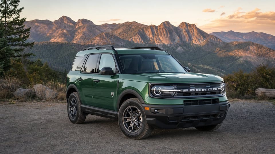 A green 2025 Ford Bronco Sport compact SUV parked at a scenic overlook.