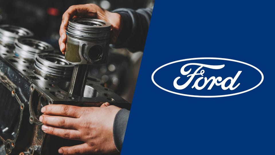 A man is working on a ford engine.|A white tesla sports car with four numbers on it.|A white tesla model s car with four blue numbers on it.|A white tesla model s car with four blue numbers on it.|A white car with blue numbers on the hood.|A white car with blue numbers on the hood.|A white car with numbers on the hood.