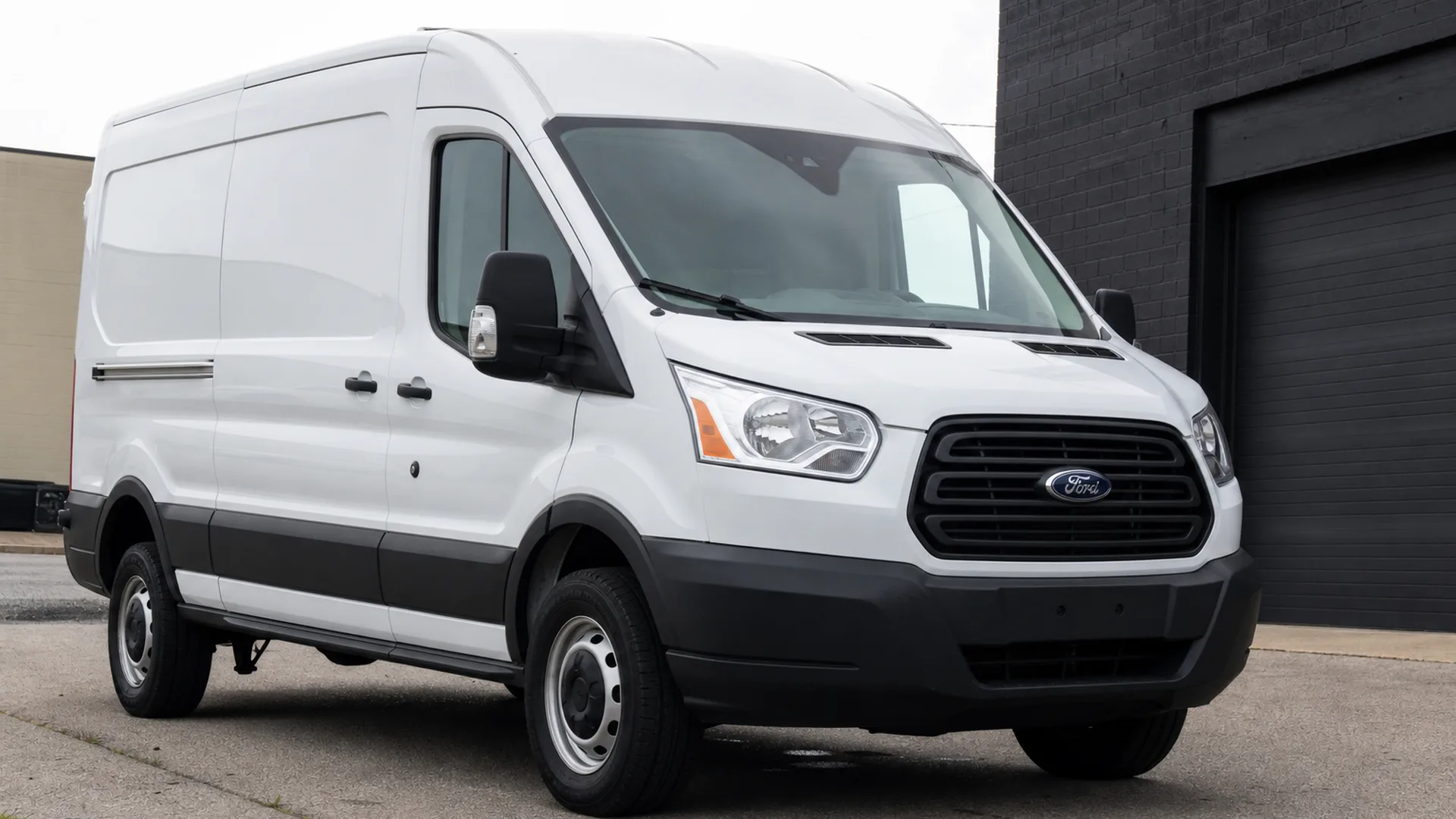 A Ford Transit parked outdoors.