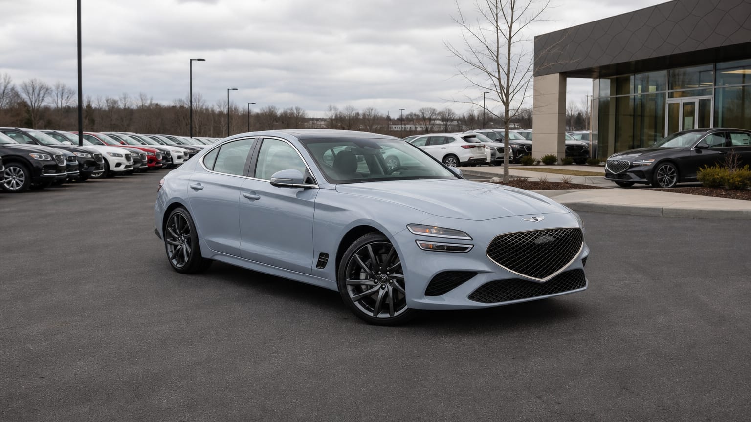 A higher-risk Genesis G70 model year parked in a dealership lot.