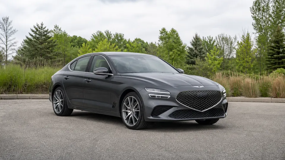 A Genesis G70 sedan, three-quarter front view, parked outdoors.
