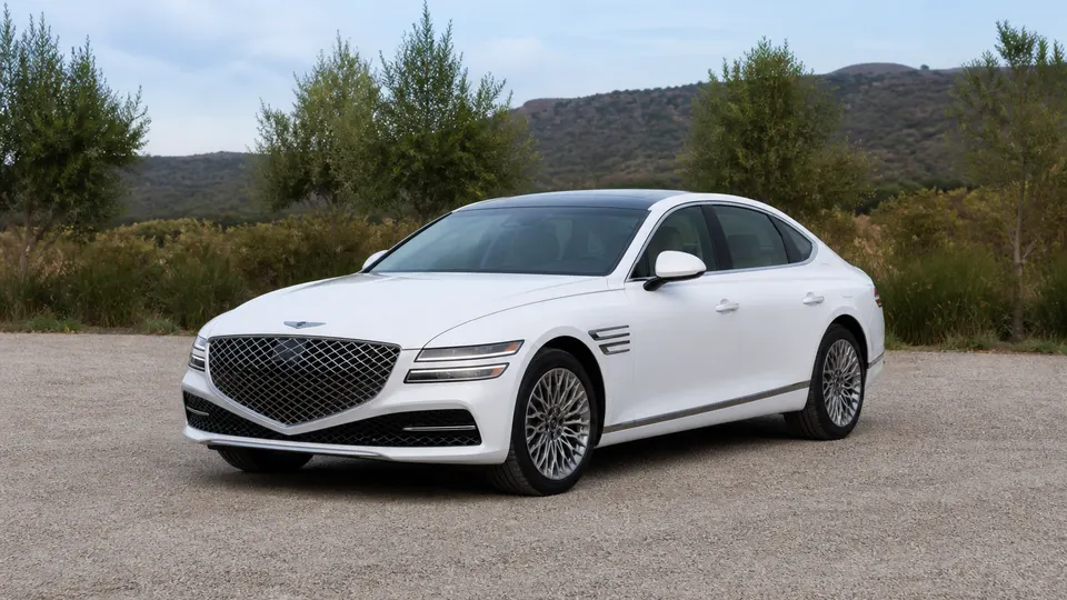 A Genesis G80 sedan, three-quarter front view, parked outdoors.