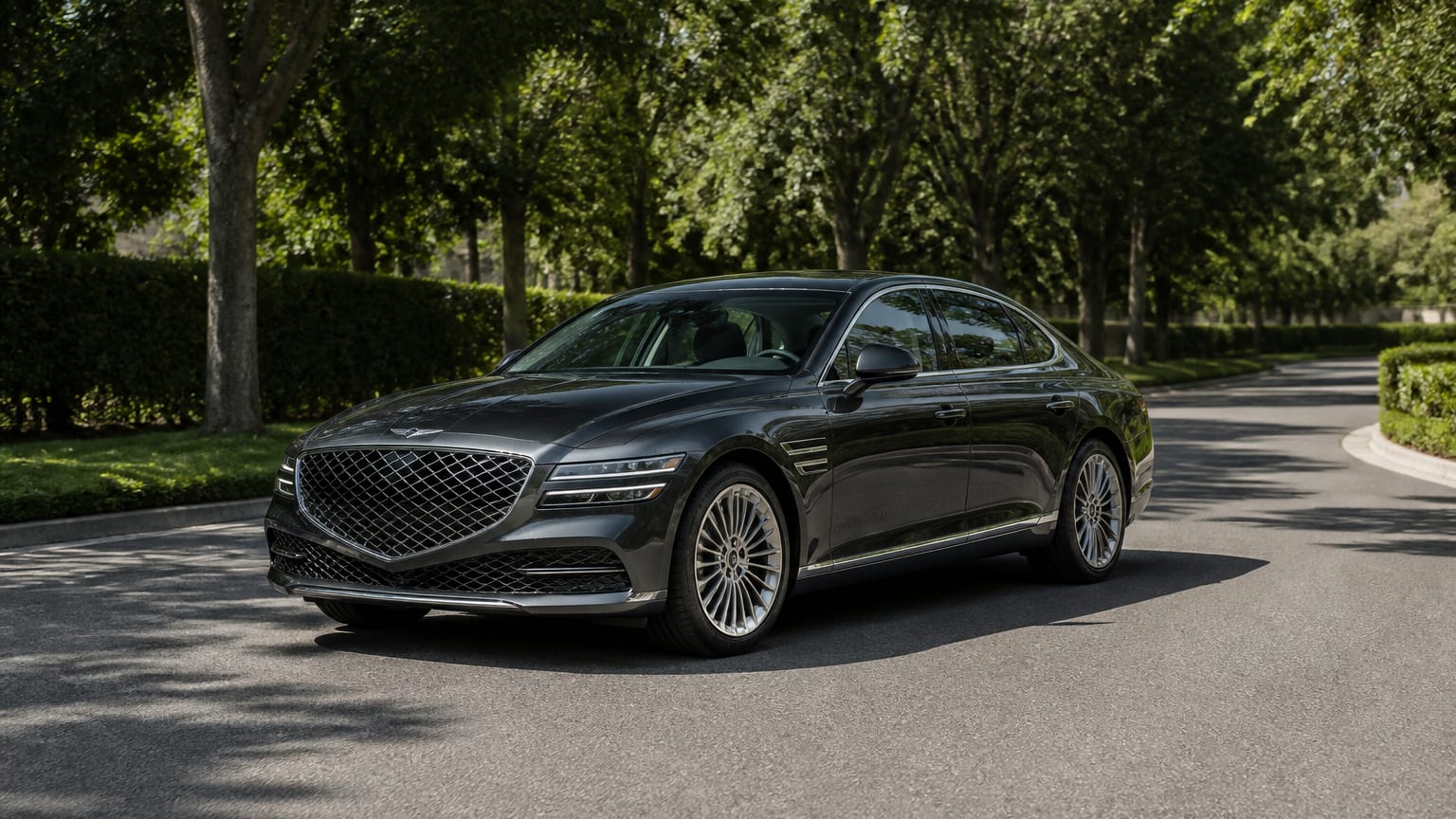 A cleaner later-model Genesis G90 on a quiet road.