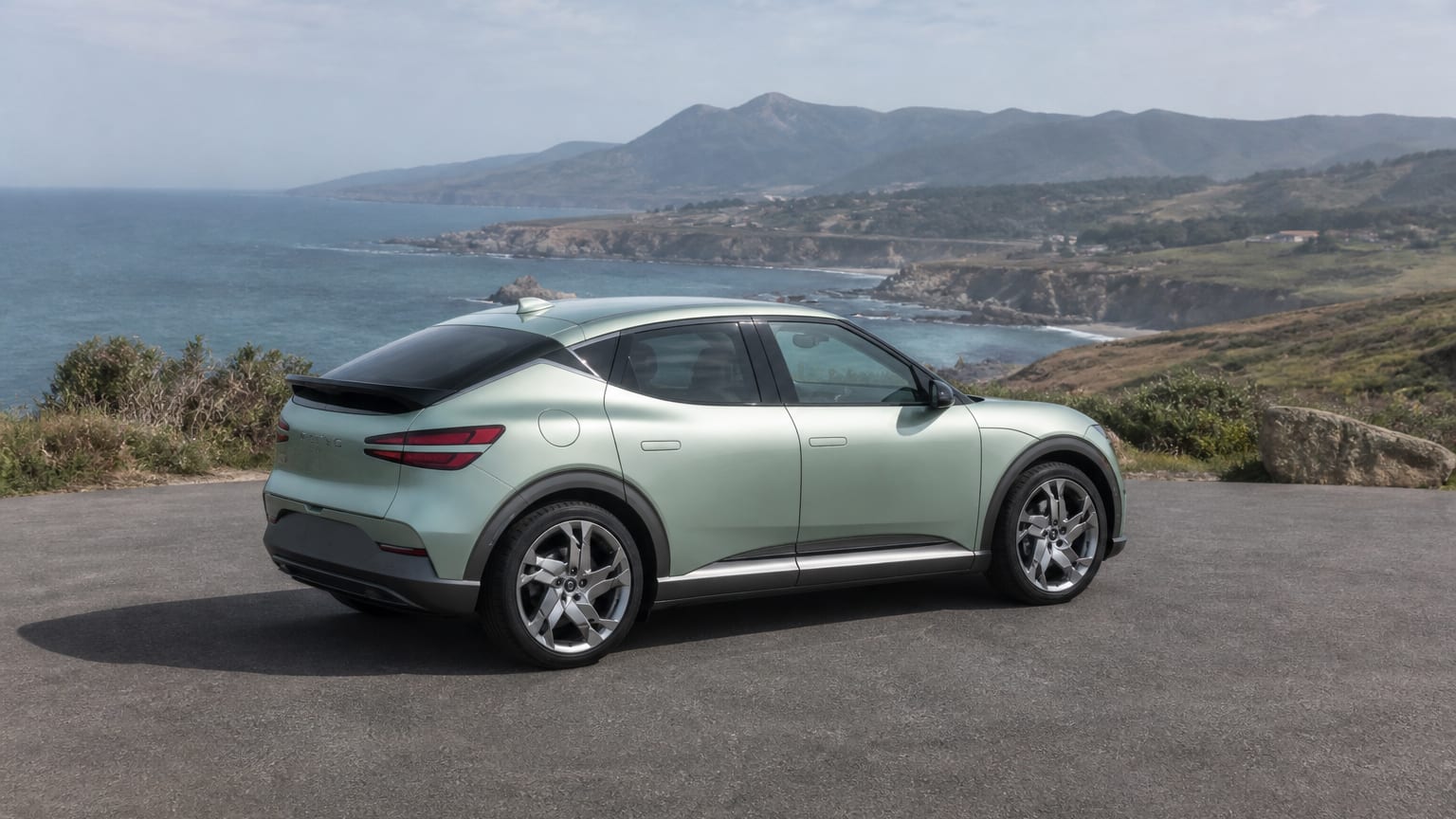 A Genesis GV60 parked outdoors, three-quarter front view.