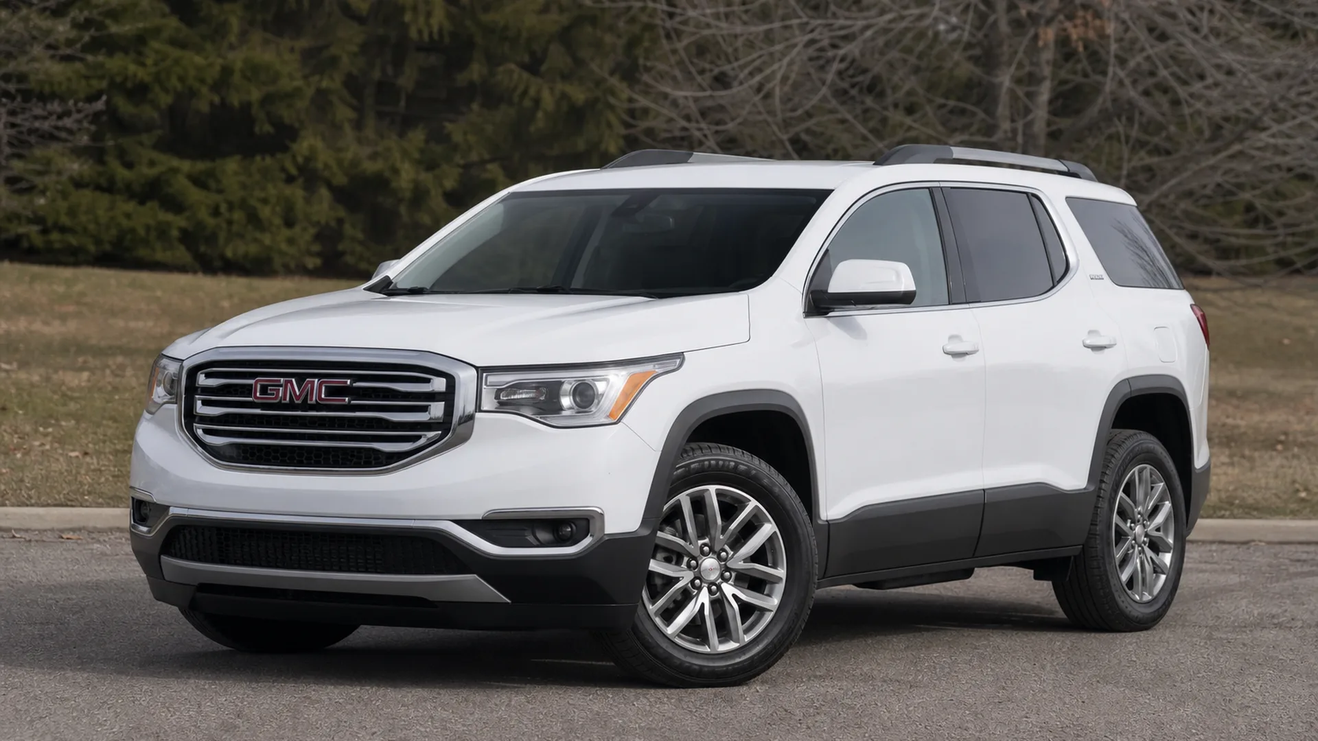 A GMC Acadia parked outdoors.