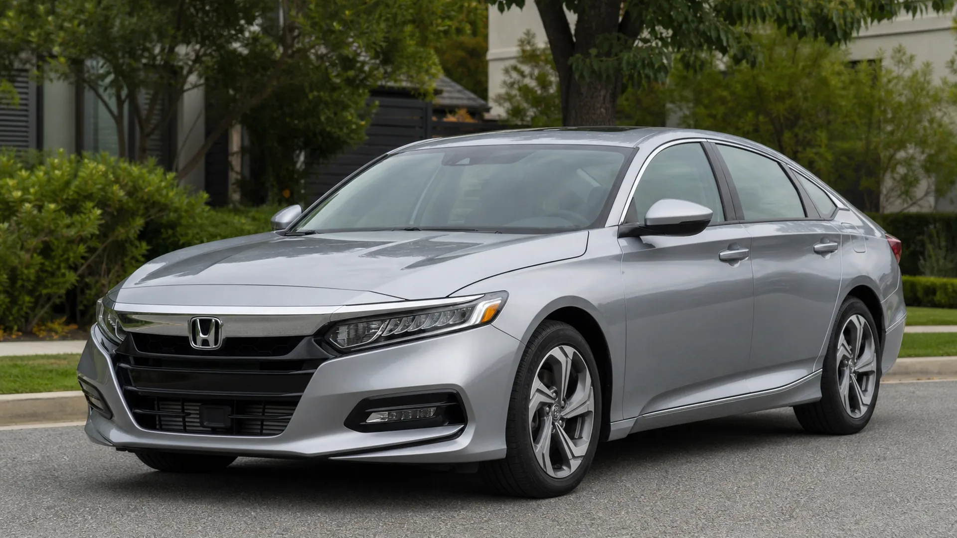 A silver Honda Accord sedan parked on a residential street.