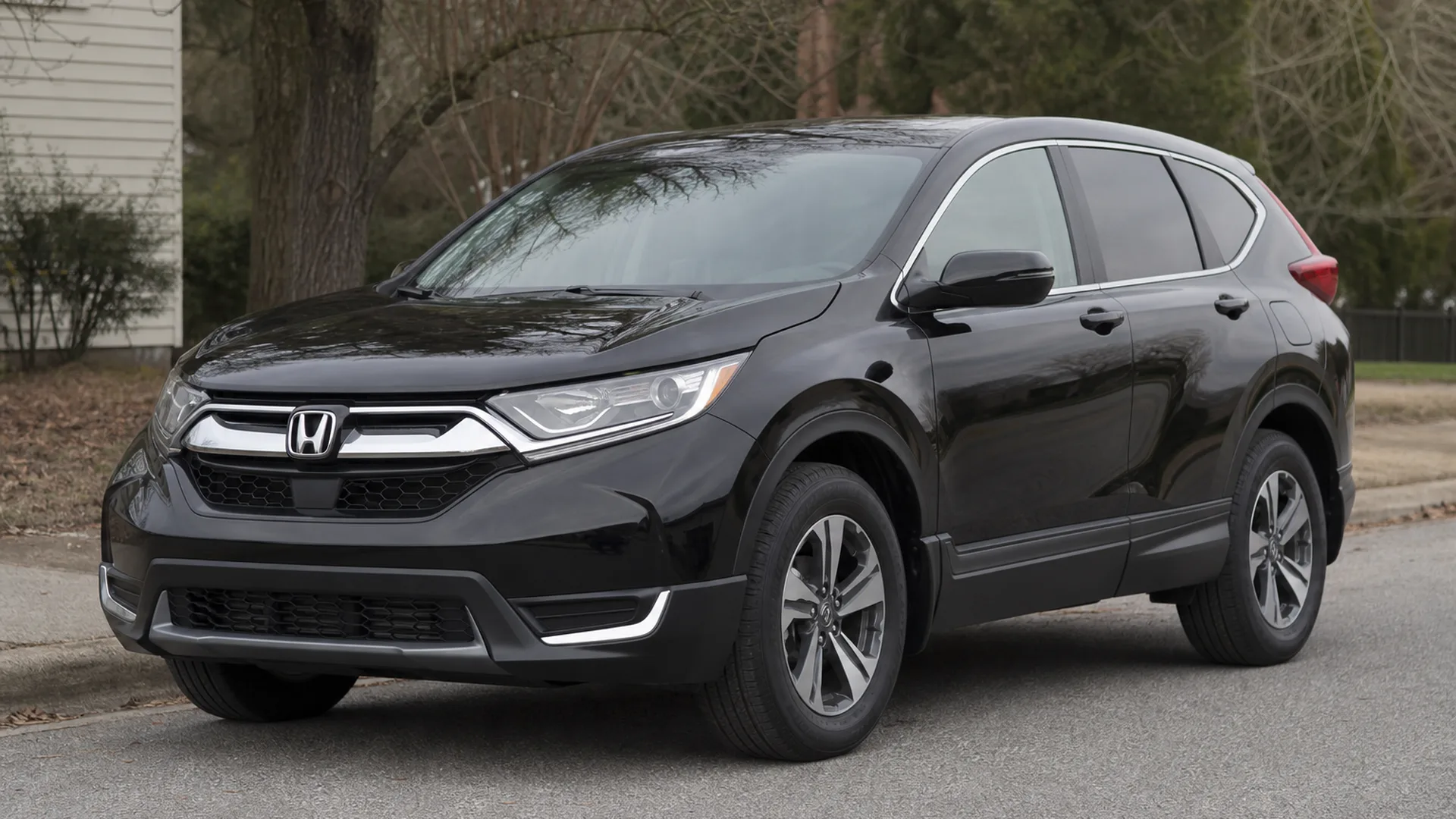 A black Honda CR-V crossover parked on a street.