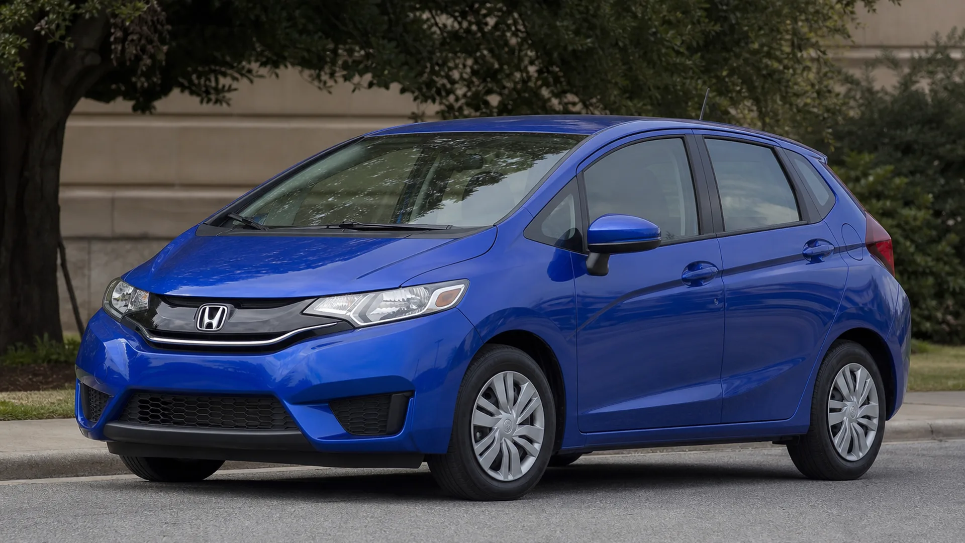 A Honda Fit parked outdoors.