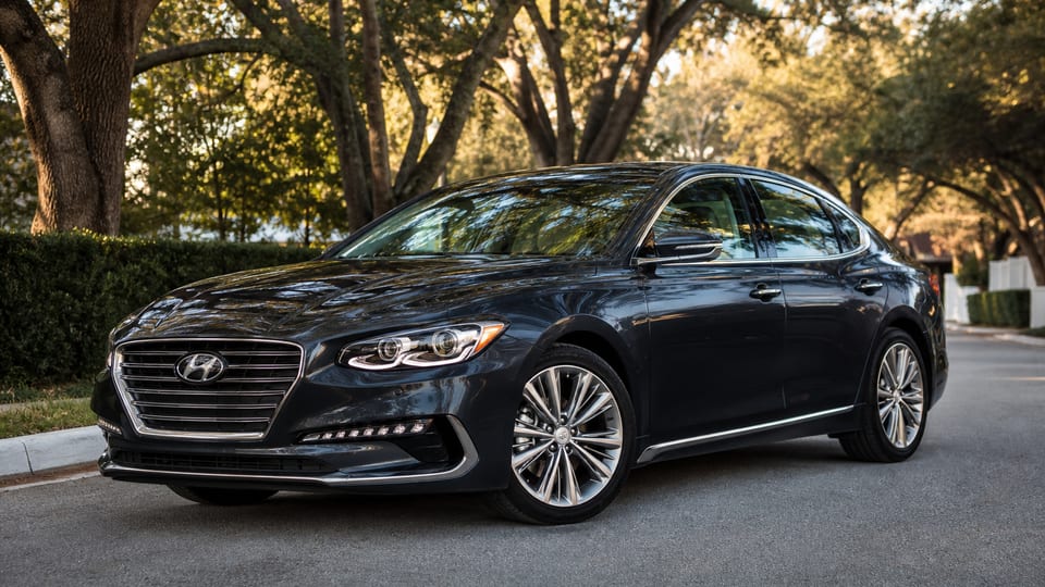 A dark gray 2017 Hyundai Azera Limited parked on a quiet street.