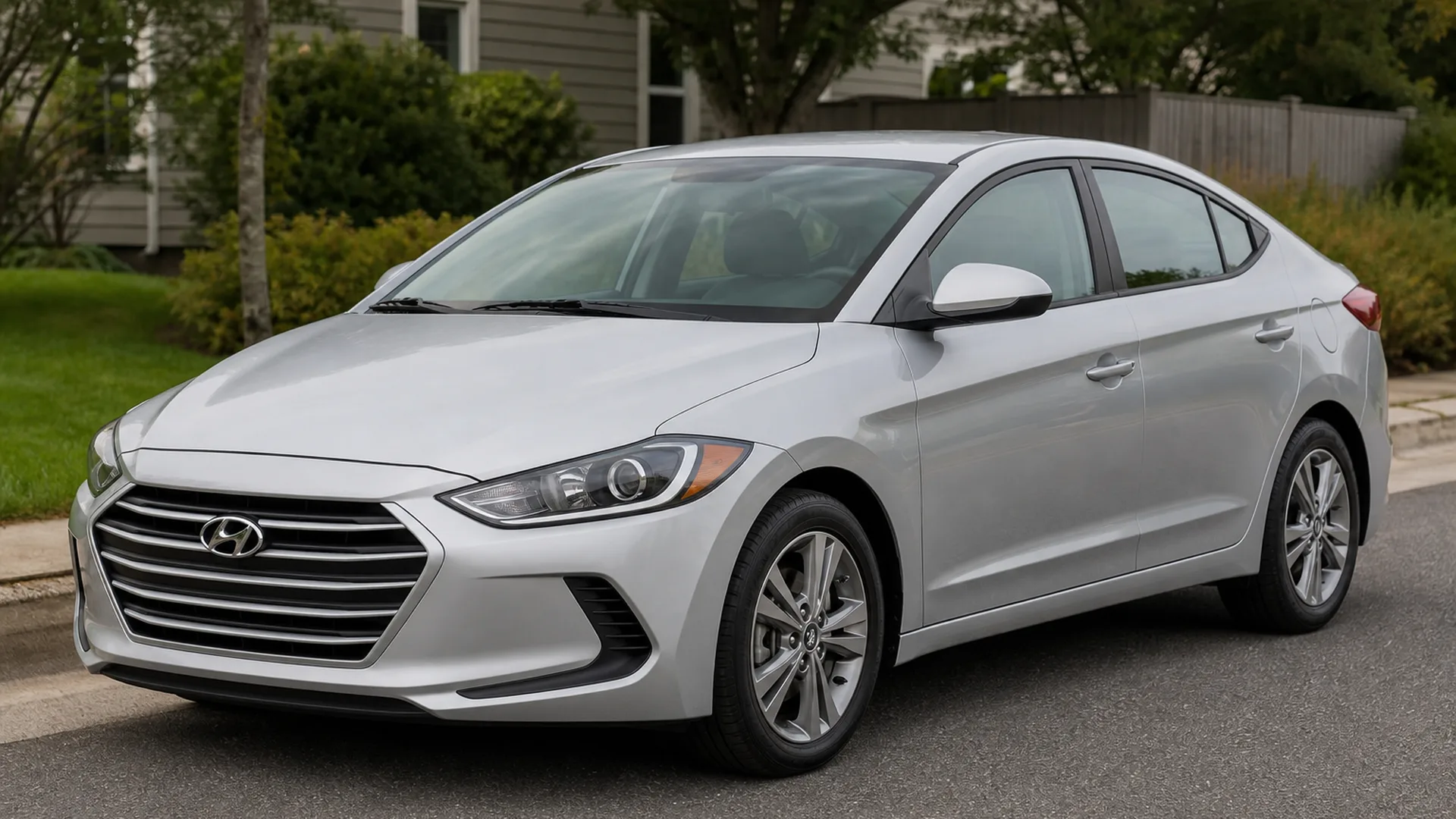 A silver Hyundai Elantra sedan parked on a residential street.