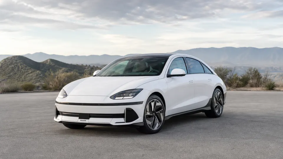A Hyundai Ioniq 6 electric sedan, three-quarter front view, parked outdoors.