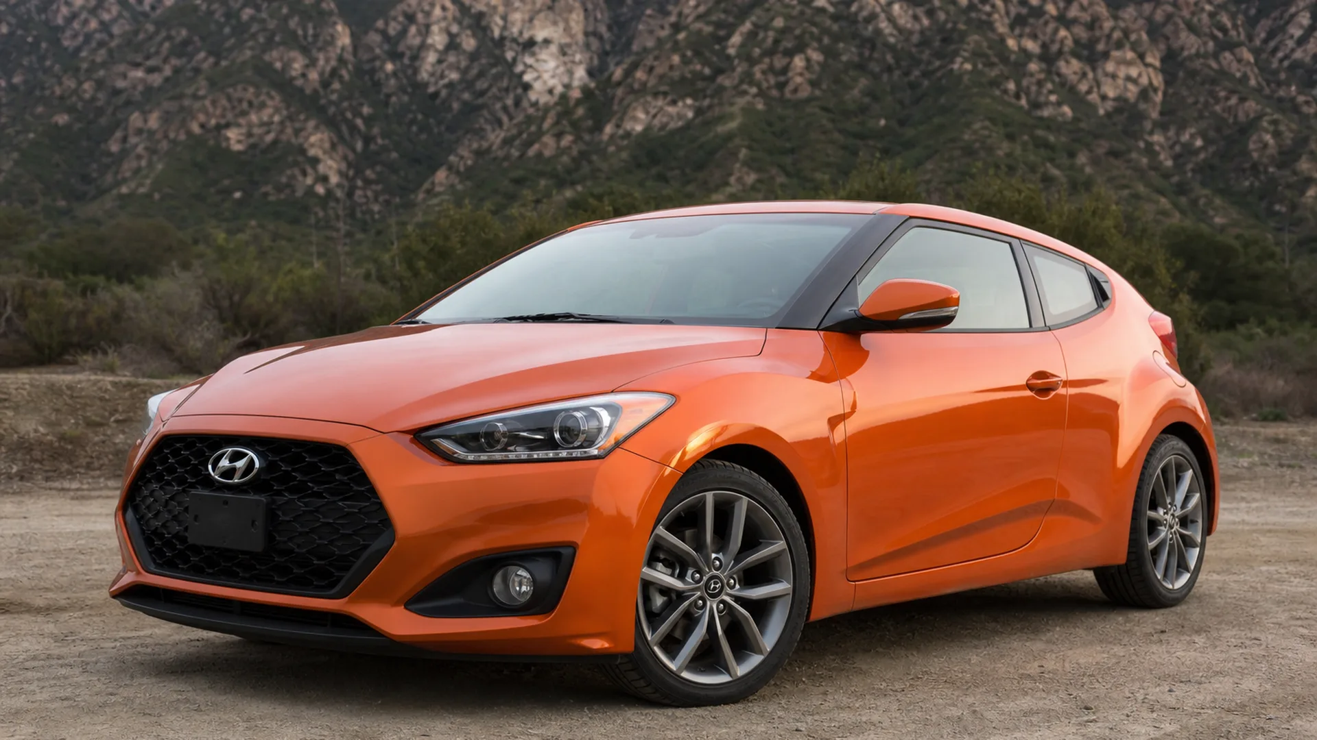 A Hyundai Veloster parked outdoors.