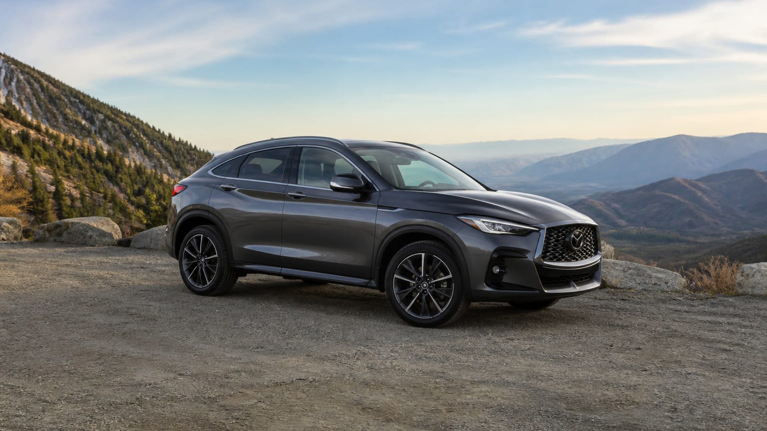 A Infiniti QX55 parked outdoors, three-quarter front view.