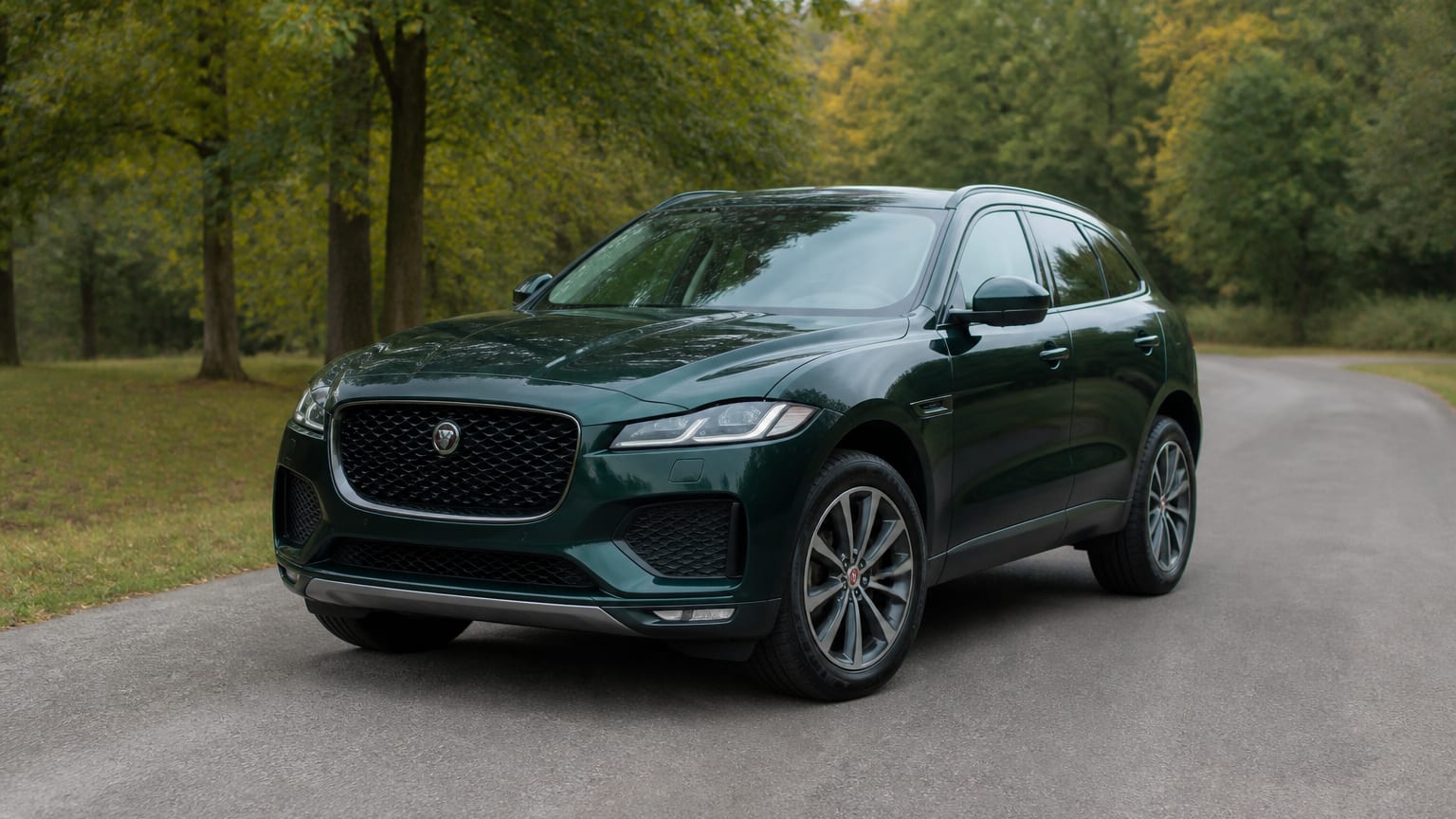 A cleaner later-model Jaguar F-Pace on a quiet road.