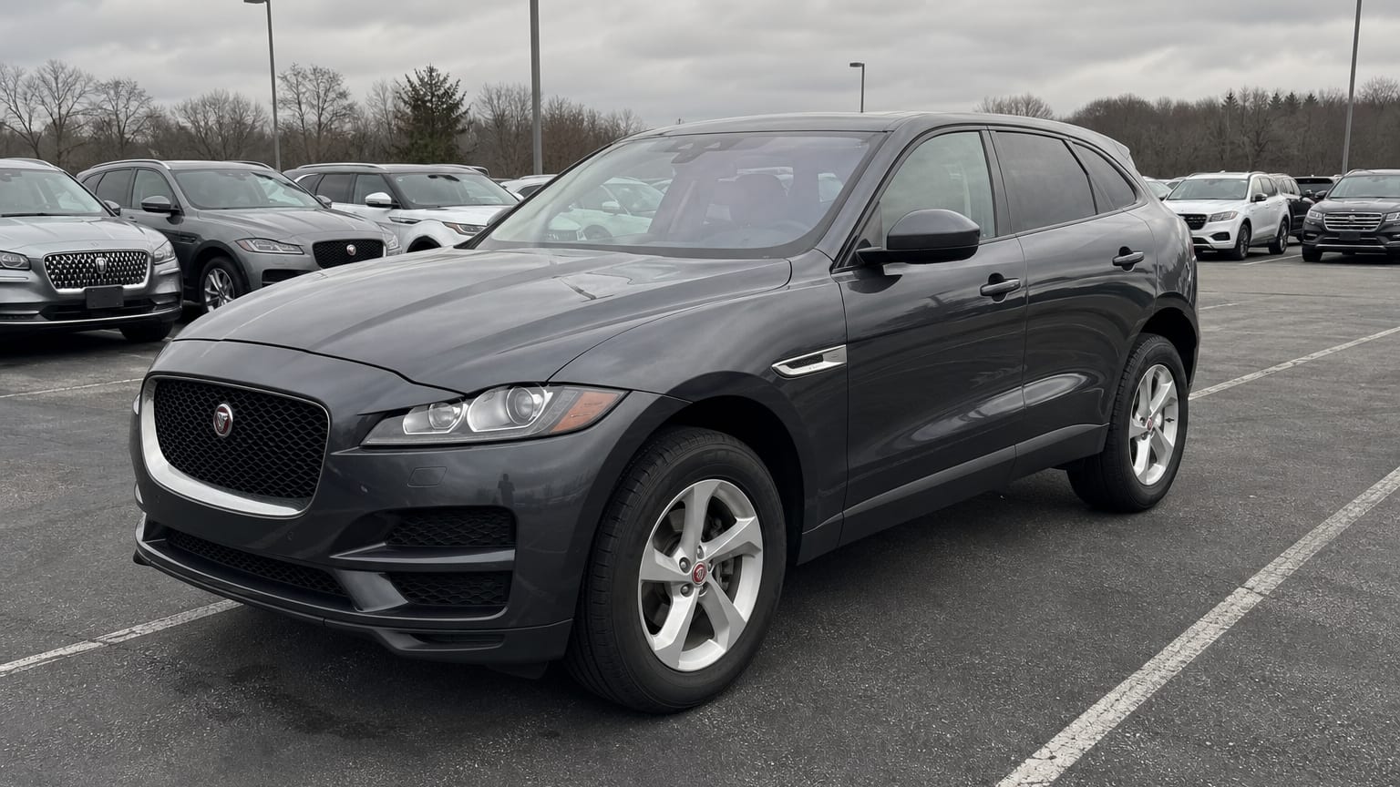 A higher-risk Jaguar F-Pace model year parked in a dealership lot.