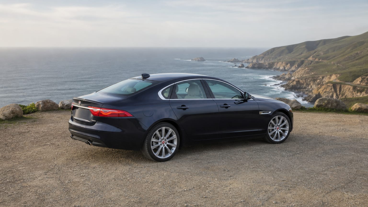 A Jaguar XF parked outdoors, three-quarter front view.