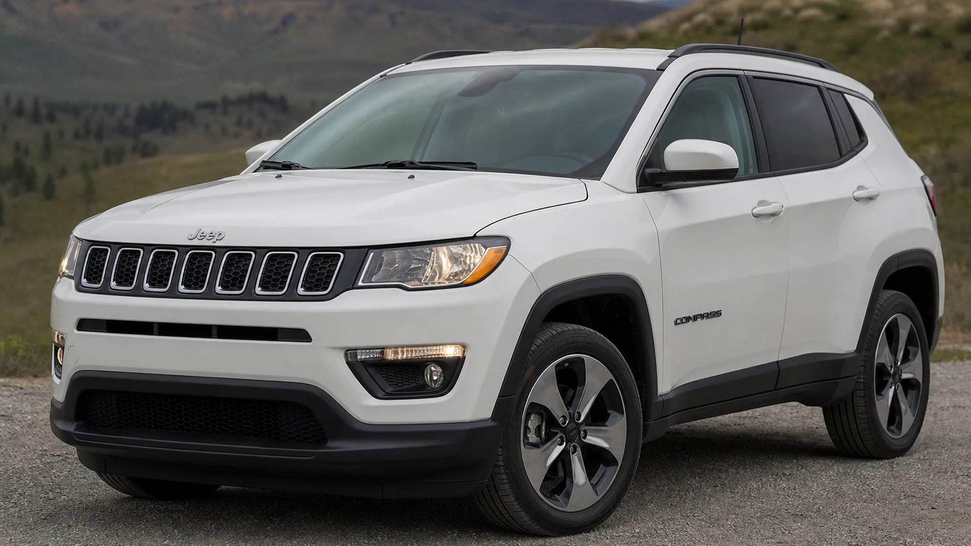 A Jeep Compass parked outdoors.