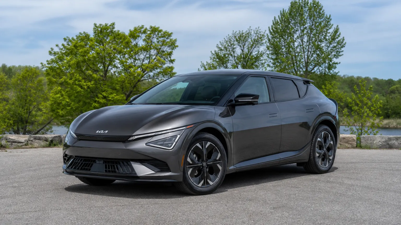 A Kia EV6 electric crossover, three-quarter front view, parked outdoors.