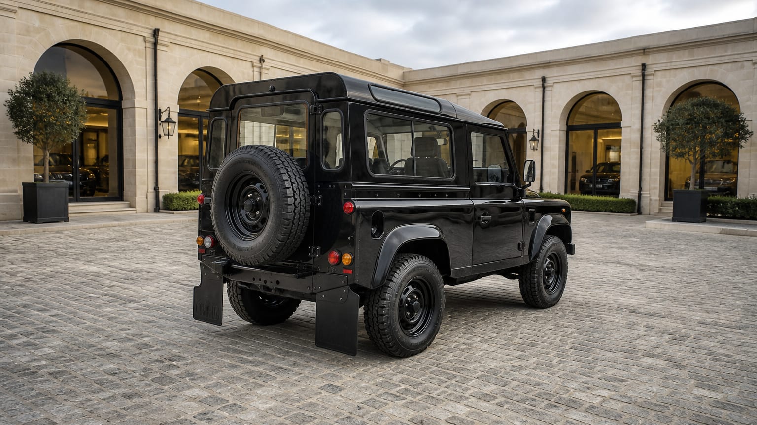 A higher-risk Land Rover Defender model year parked in a dealership lot.