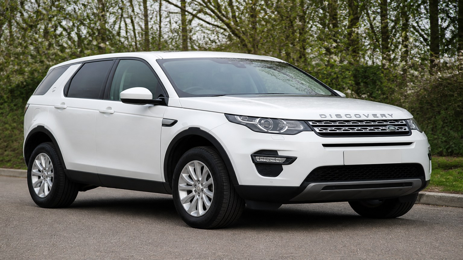 A higher-risk Land Rover Discovery Sport model year parked in a dealership lot.