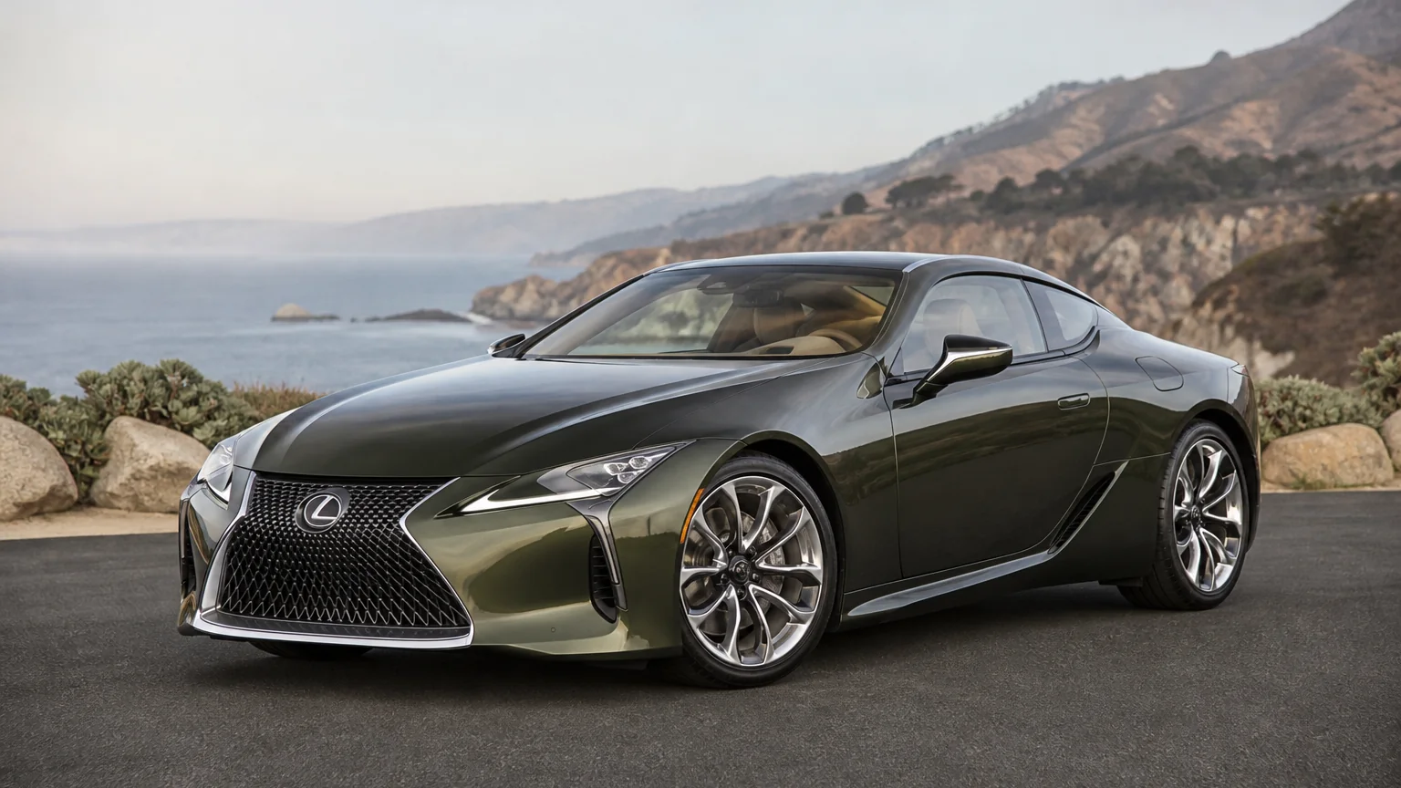 A Lexus LC grand tourer, three-quarter front view, parked on a quiet street.