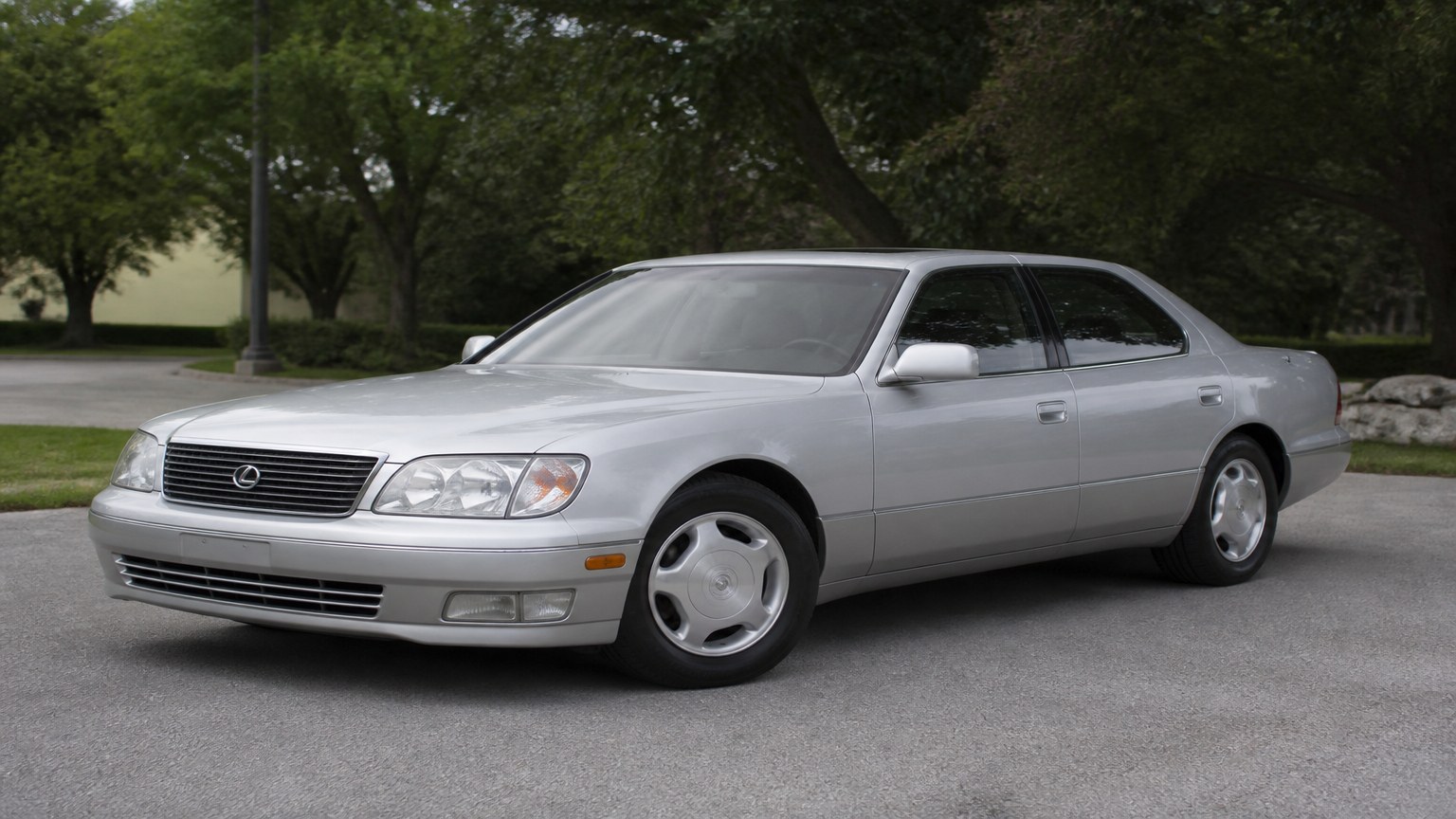 A cleaner later-model Lexus LS 400 on a quiet road.