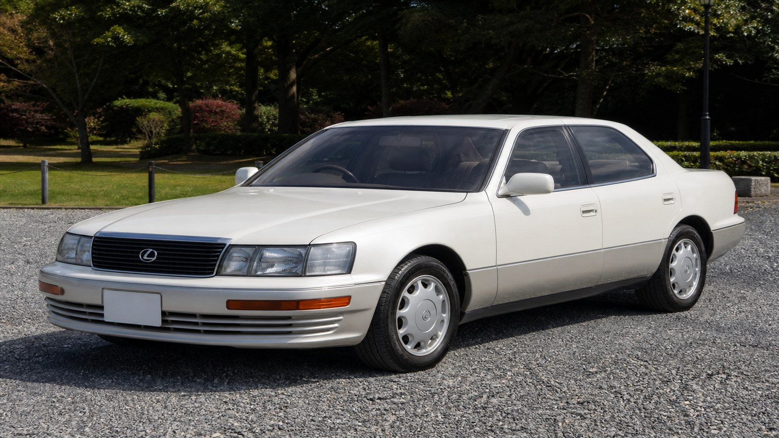 A Lexus LS 400 parked outdoors, three-quarter front view.