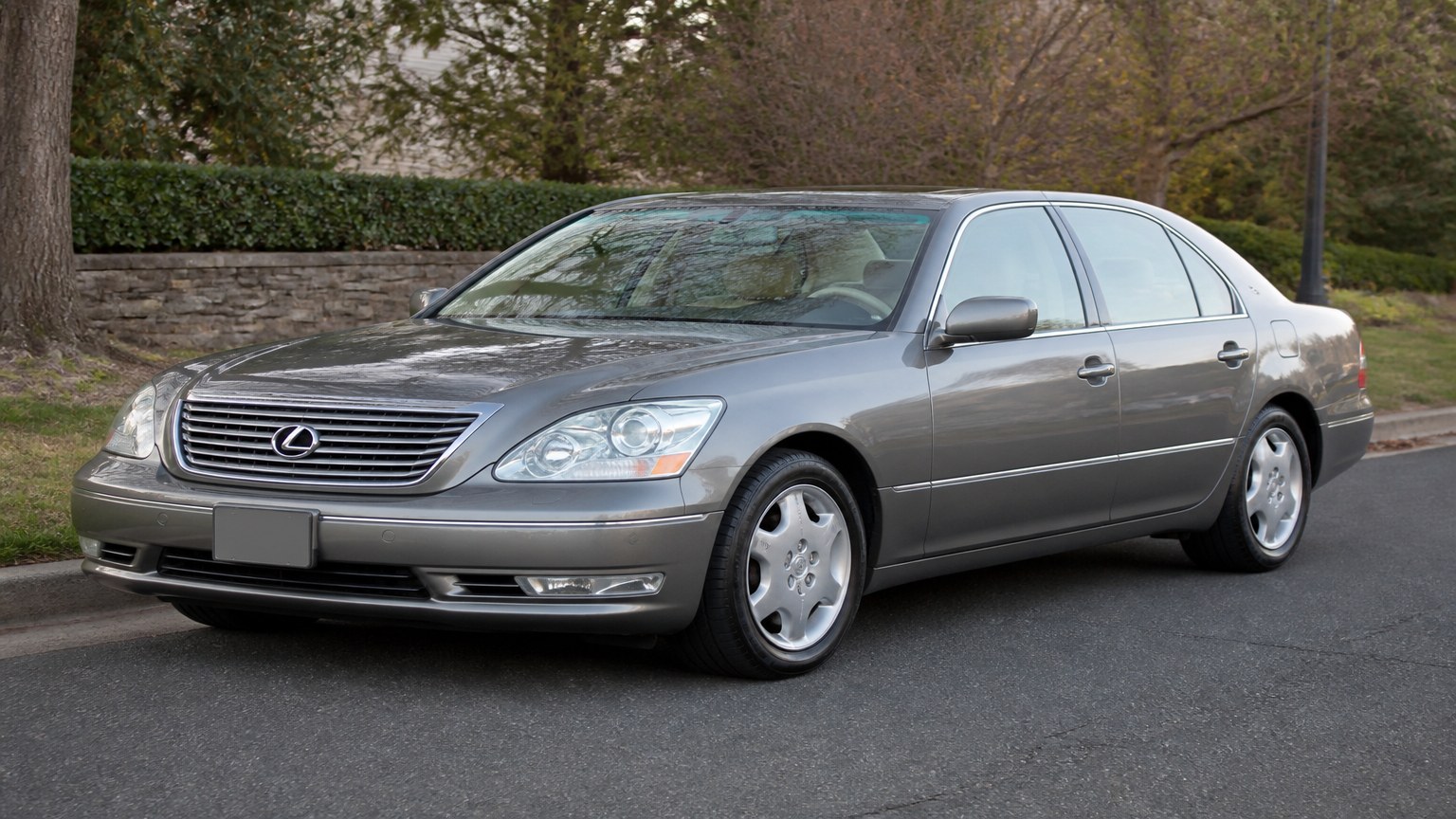 A cleaner later-model Lexus LS 430 on a quiet road.