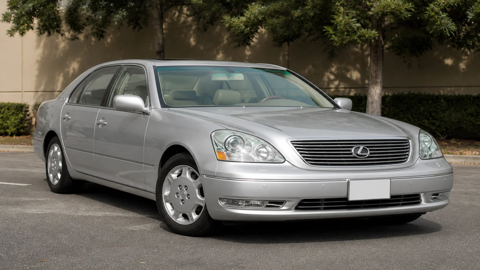 A Lexus LS 430 luxury sedan, three-quarter front view, parked on a quiet street.